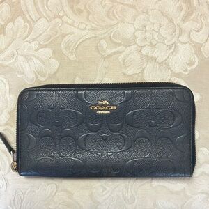 Coach signature embossed C print zip around wallet